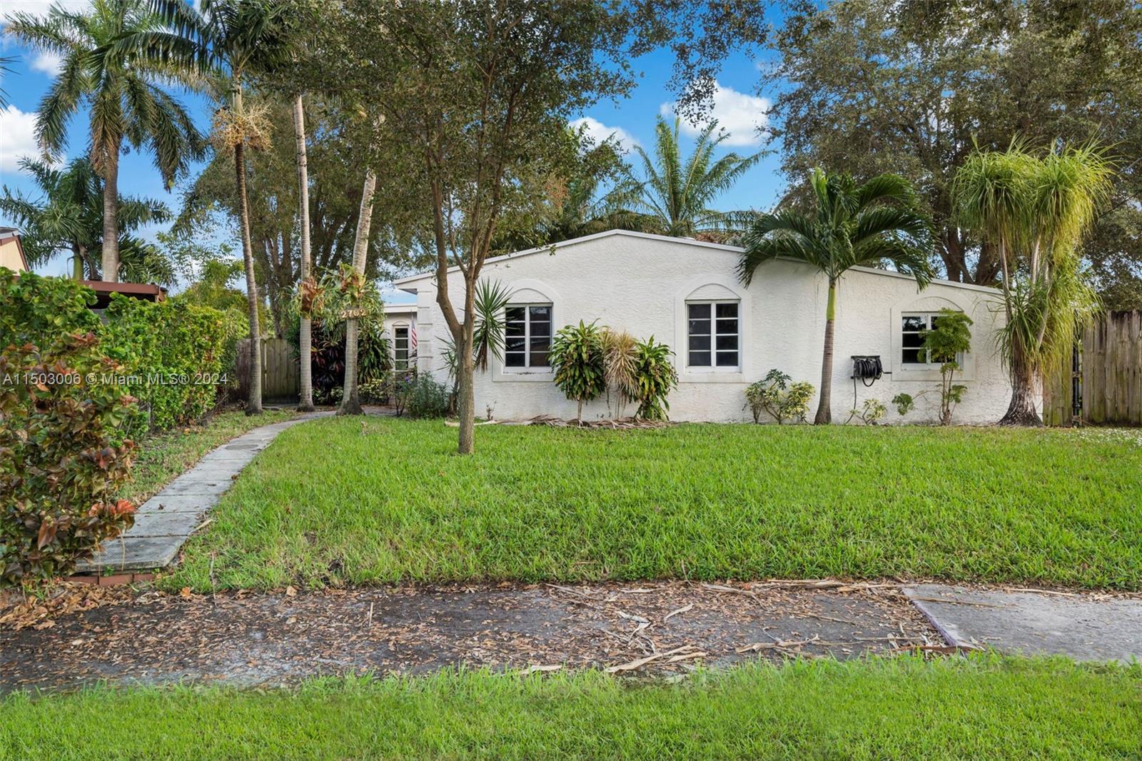 2702 Scott Street Hollywood, FL 33020 - Photo 42 of 42 a front view of a house with garden