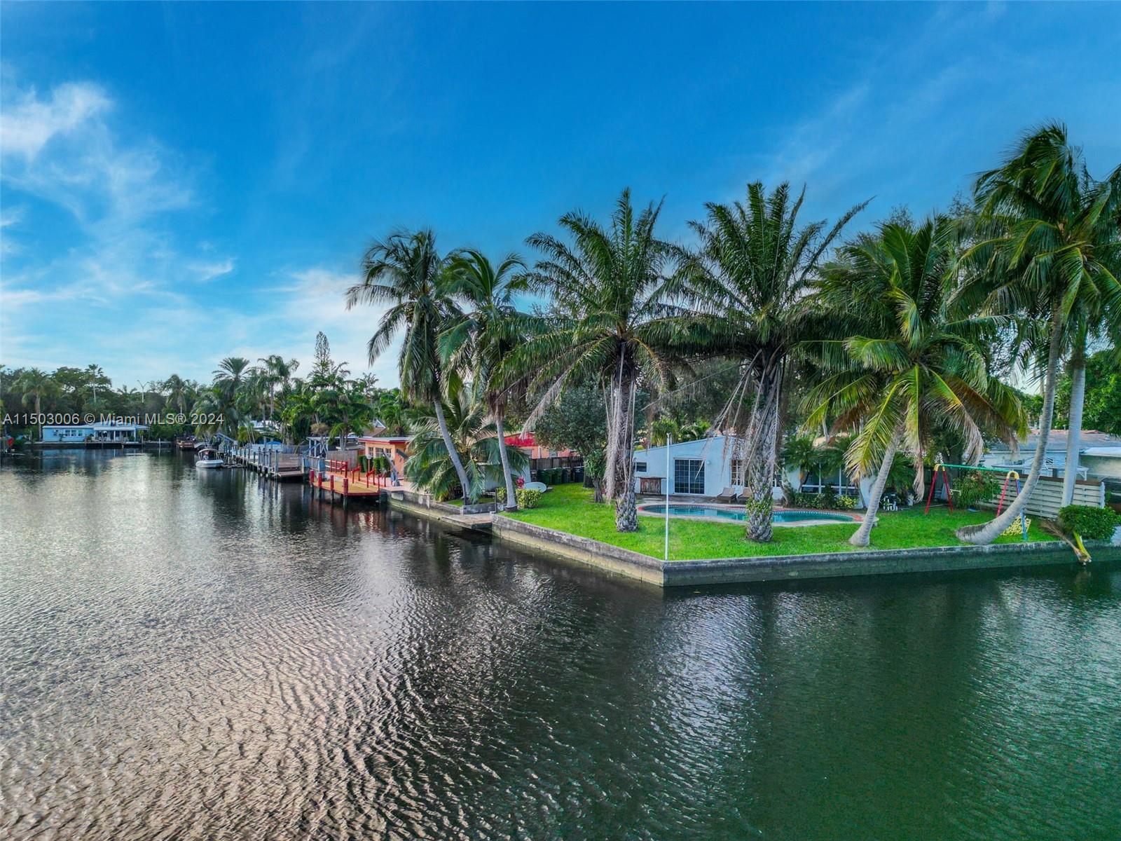 2702 Scott Street Hollywood, FL 33020 - Photo 9 of 42 a view of a swimming pool with a lake view