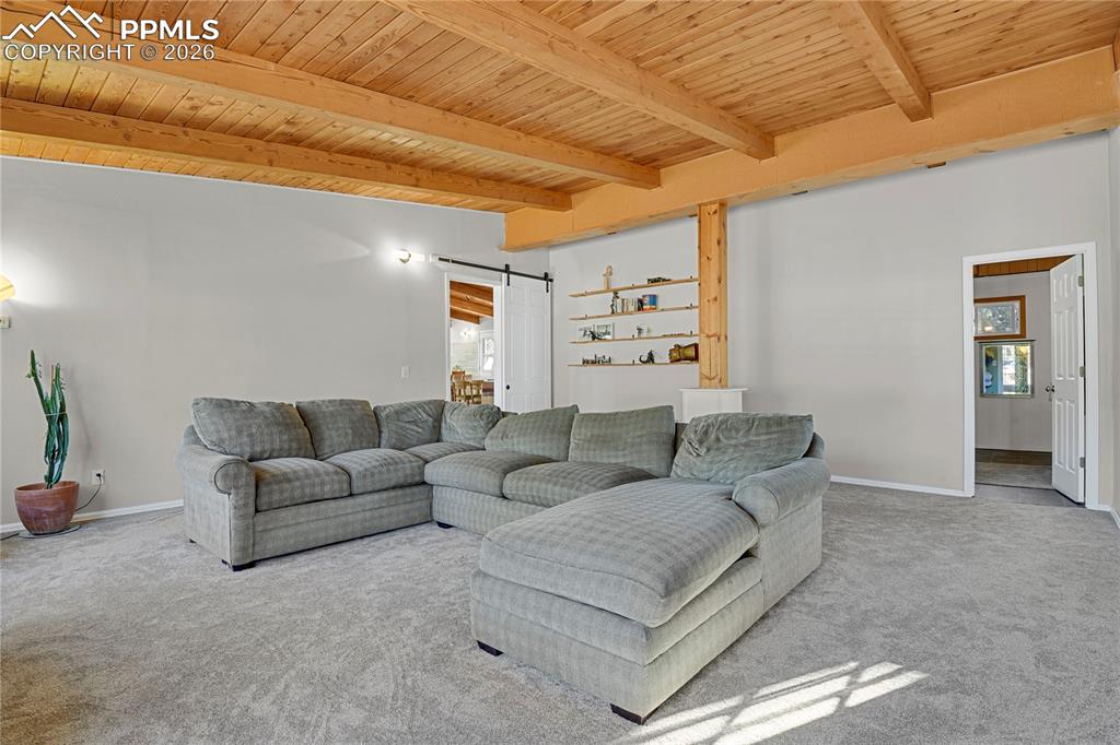 7015 McFerran Road Colorado Springs, CO 80908 - Photo 19 of 50 a living room with furniture and a flat screen tv