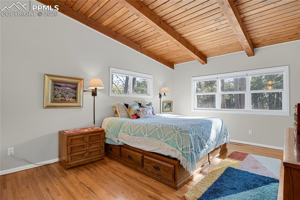 7015 McFerran Road Colorado Springs, CO 80908 - Photo 26 of 50 a bed room with a bed and a large window