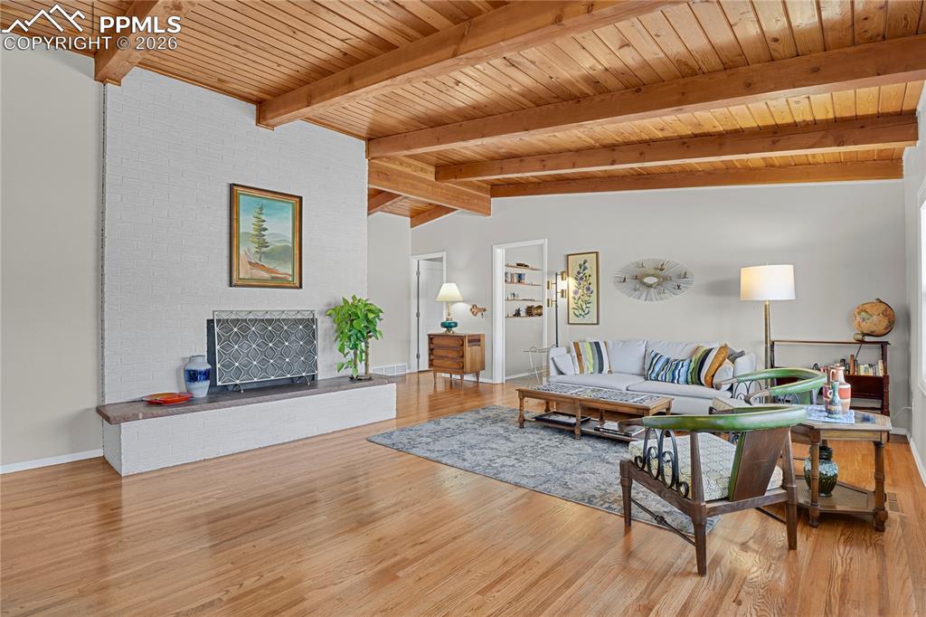 7015 McFerran Road Colorado Springs, CO 80908 - Photo 3 of 50 a living room with furniture and wooden floor