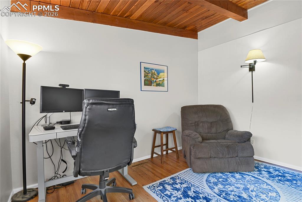 7015 McFerran Road Colorado Springs, CO 80908 - Photo 35 of 50 a living room with furniture and a flat screen tv