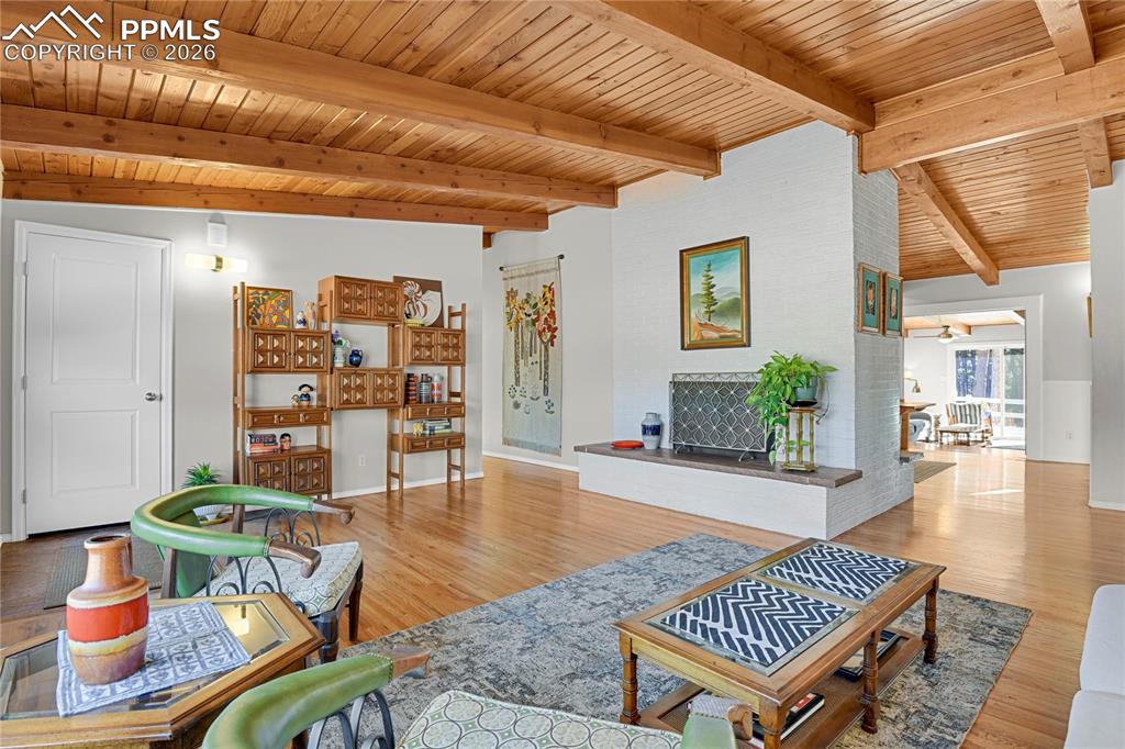 7015 McFerran Road Colorado Springs, CO 80908 - Photo 4 of 50 a living room with furniture and wooden floor