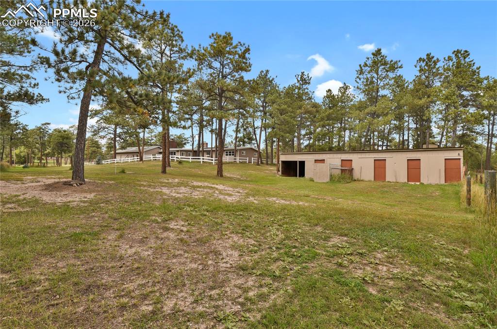7015 McFerran Road Colorado Springs, CO 80908 - Photo 46 of 50 a tall building in the middle of a yard