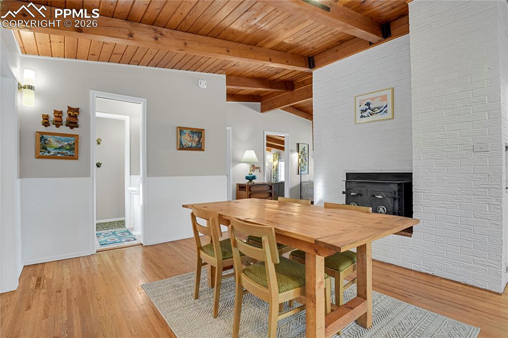 7015 McFerran Road Colorado Springs, CO 80908 - Photo 9 of 50 a view of a dining room with furniture and wooden floor