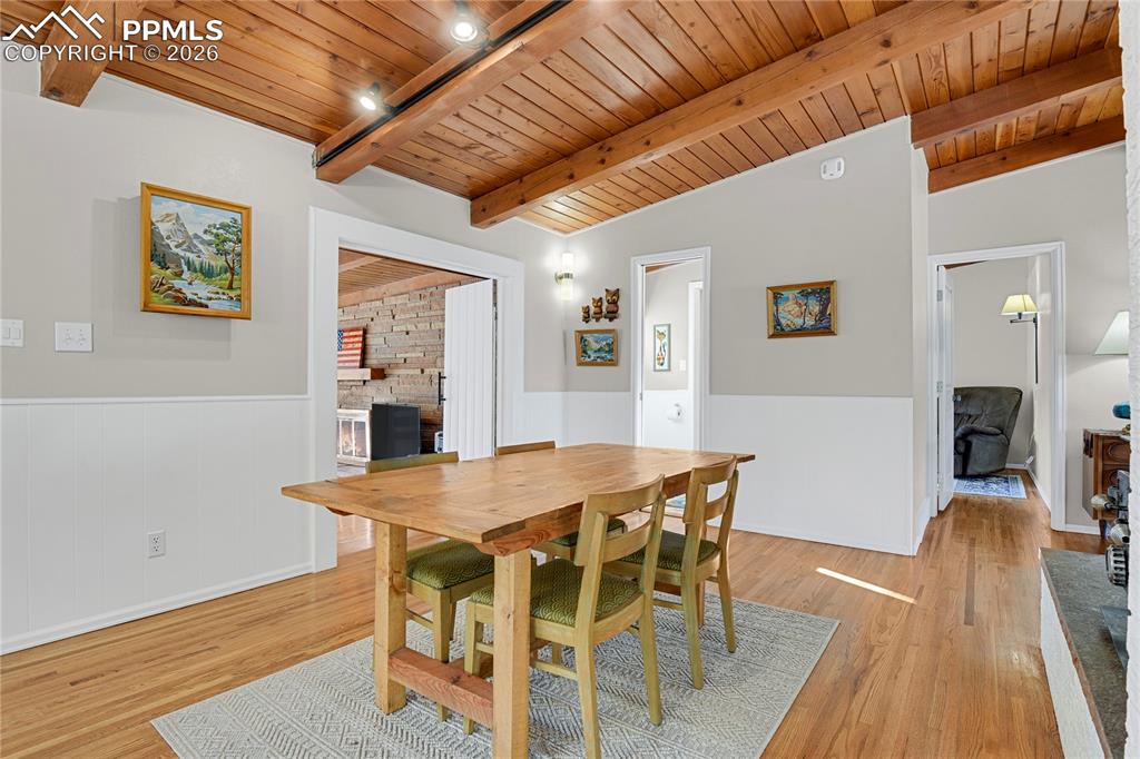 7015 McFerran Road Colorado Springs, CO 80908 - Photo 10 of 50 a view of a dining room with furniture and wooden floor
