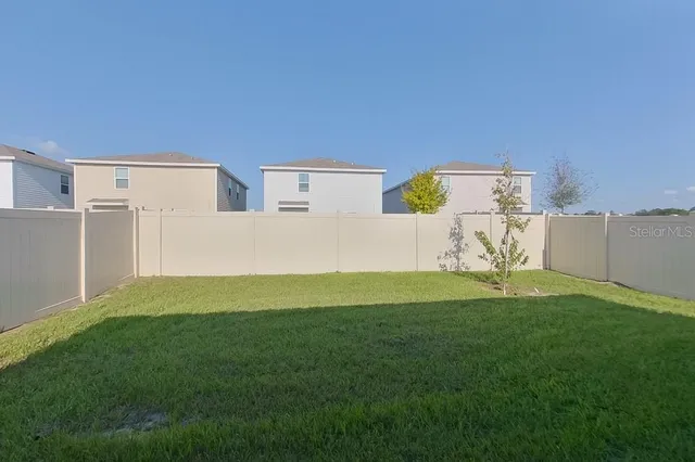 a house view with a play ground