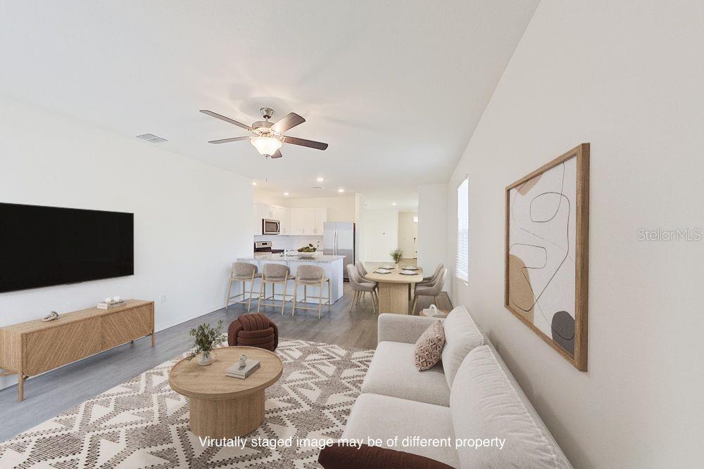 8731 Southwest 44th Court Ocala, FL 34476 - Photo 6 of 20 a living room with furniture and a flat screen tv