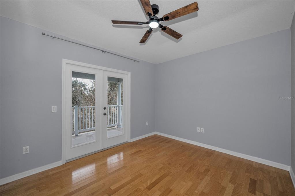 10125 Palladio Drive New Port Richey, FL 34655 - Photo 42 of 97 wooden floor in an empty room with a window