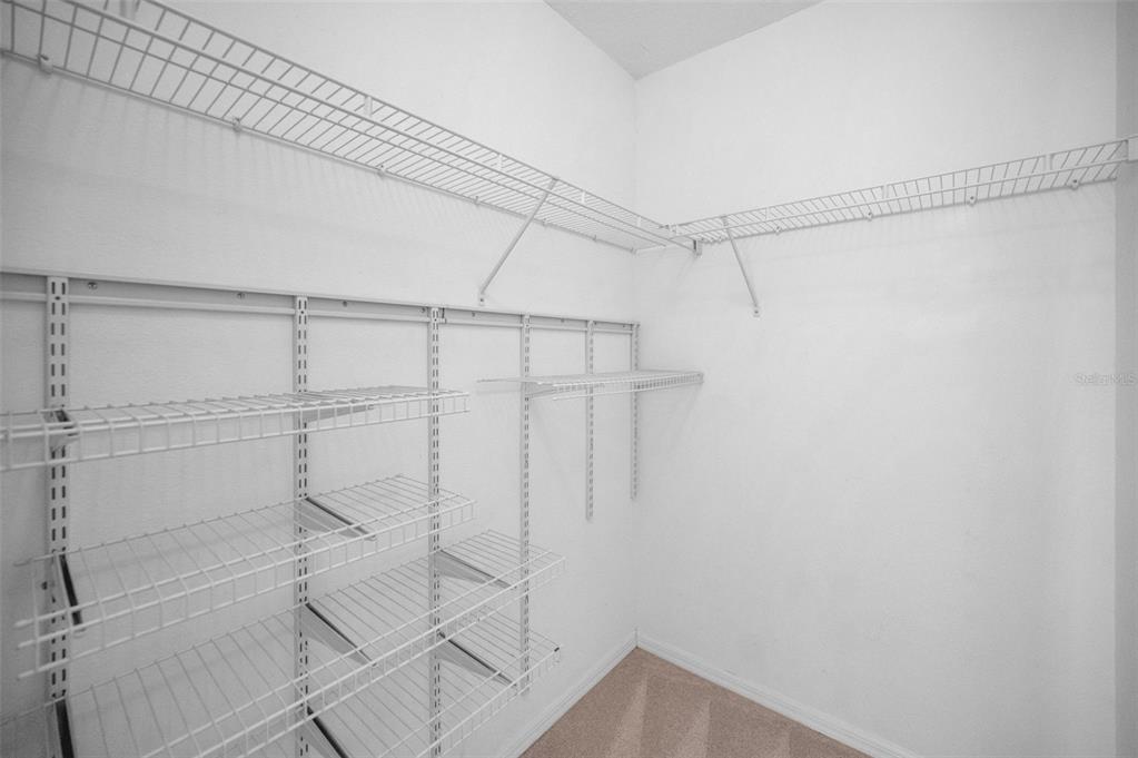 10125 Palladio Drive New Port Richey, FL 34655 - Photo 47 of 97 a bathroom with a glass shower door