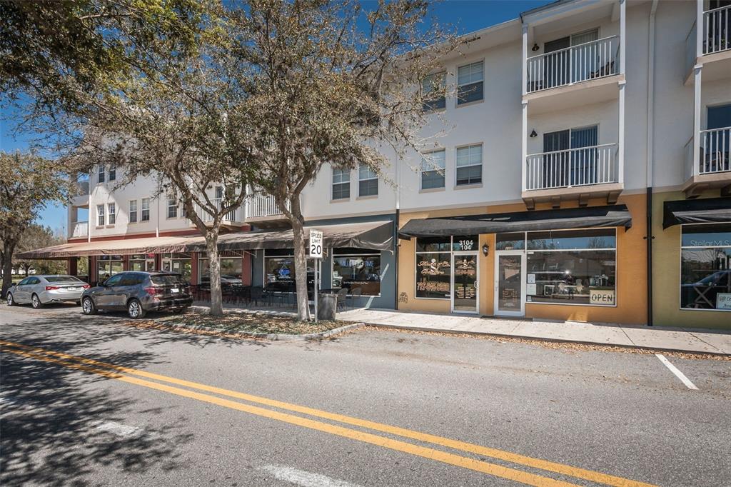 10125 Palladio Drive New Port Richey, FL 34655 - Photo 83 of 97 front view of a building with a garden