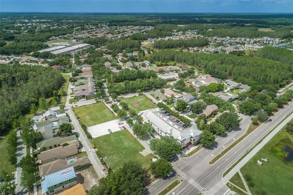 10125 Palladio Drive New Port Richey, FL 34655 - Photo 94 of 97 an aerial view of residential houses with outdoor space and trees