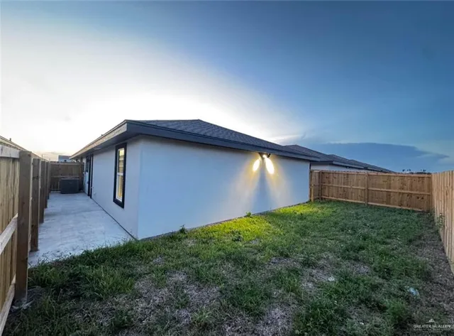 a view of backyard with potted plants