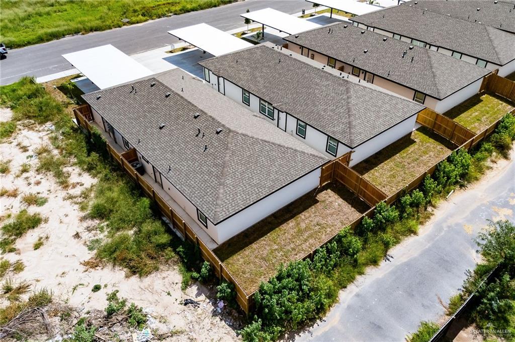 1604 Shadow Creek, Unit 1 Weslaco, TX 78596 - Photo 17 of 19 an aerial view of houses with a terrace