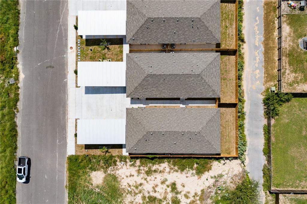 1604 Shadow Creek, Unit 1 Weslaco, TX 78596 - Photo 18 of 19 an aerial view of residential houses with outdoor space