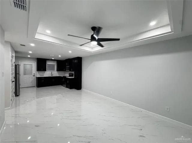 a view of kitchen and kitchen with a sink