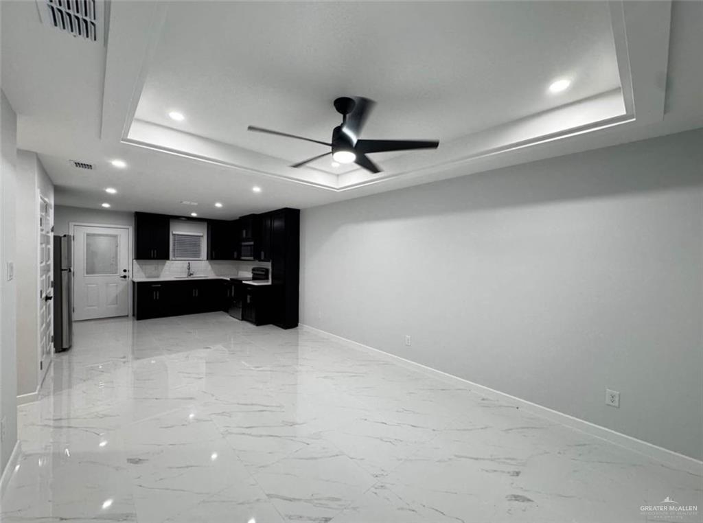 1604 Shadow Creek, Unit 1 Weslaco, TX 78596 - Photo 4 of 19 a view of kitchen and kitchen with a sink