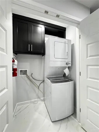 a kitchen with stainless steel appliances granite countertop a sink and a stove