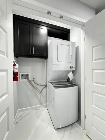 a kitchen with stainless steel appliances granite countertop a sink and a stove