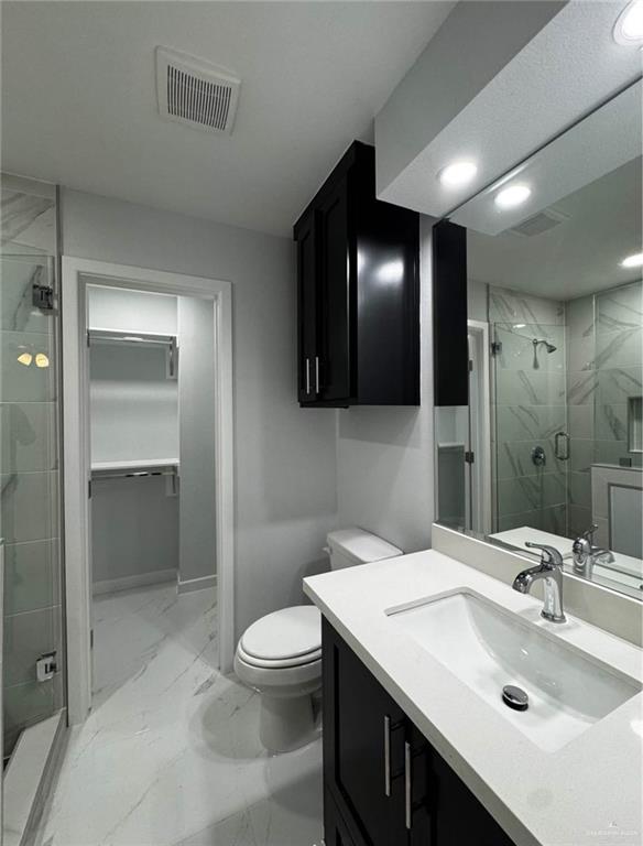 1604 Shadow Creek, Unit 1 Weslaco, TX 78596 - Photo 10 of 19 a bathroom with a sink toilet and shower