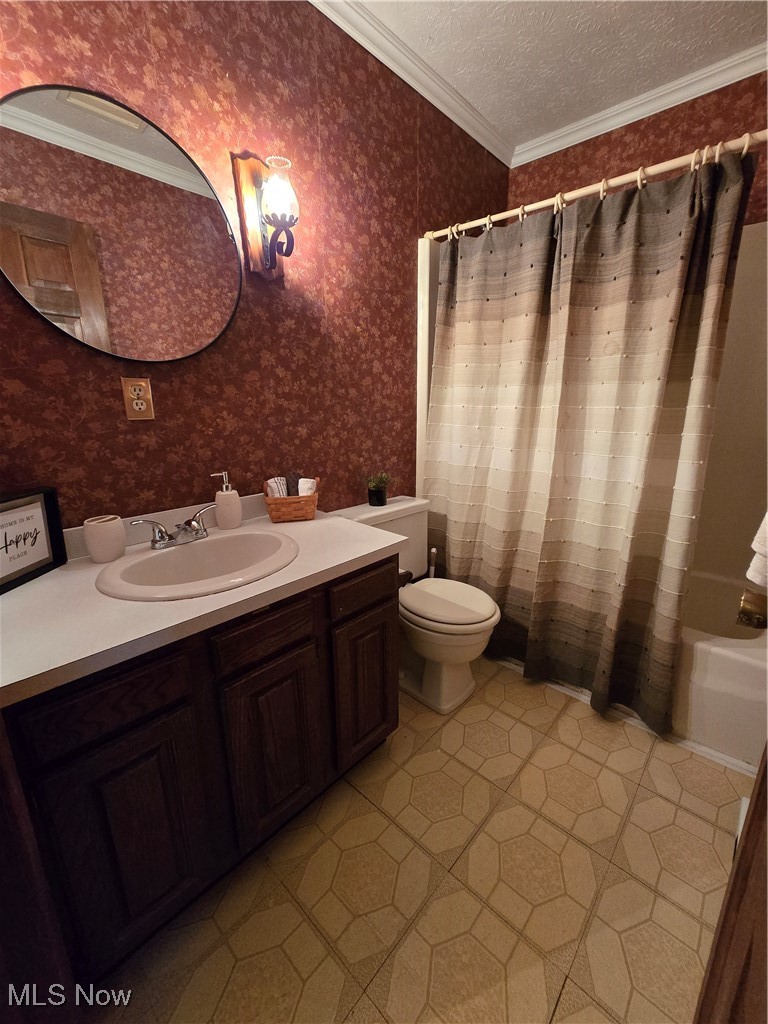 1550 North County Line Road Geneva, OH 44041 - Photo 38 of 47 Full bathroom with vanity, crown molding, shower / bath combo and toilet