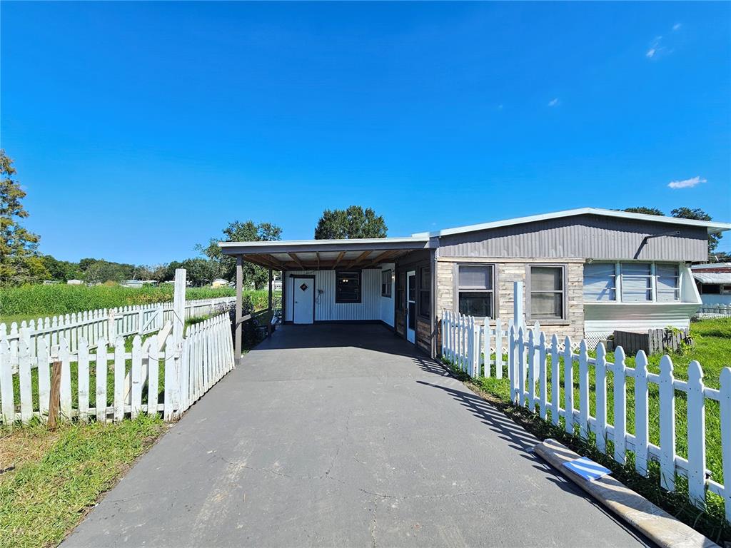 503 Longfellow Boulevard, Unit 8 Lakeland, FL 33801 - Photo 1 of 1 a view of a house with wooden fence