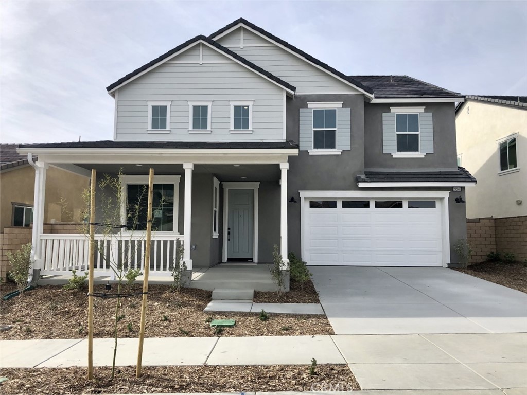 39547 Verbena Way Temecula, CA 92591 - Photo 1 of 21 a front view of a house with garden