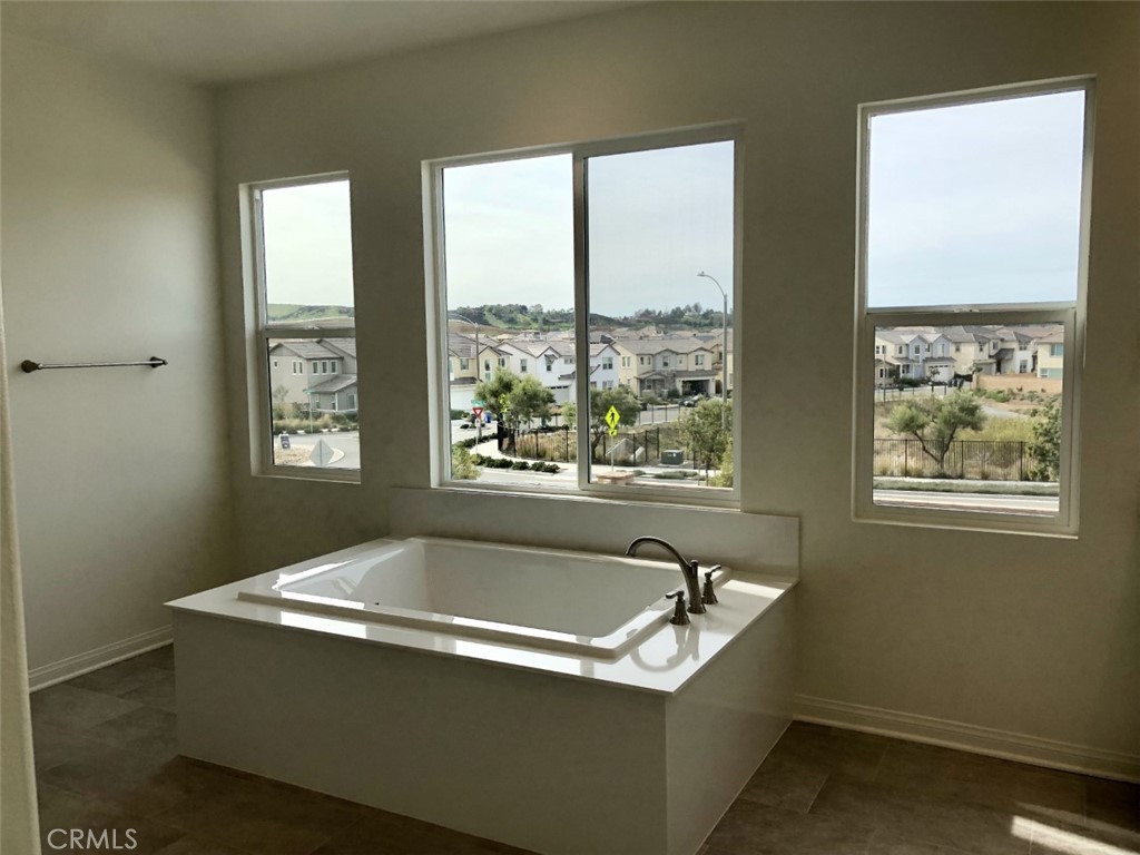 39547 Verbena Way Temecula, CA 92591 - Photo 13 of 21 a white bath tub sitting in a bathroom next to a window