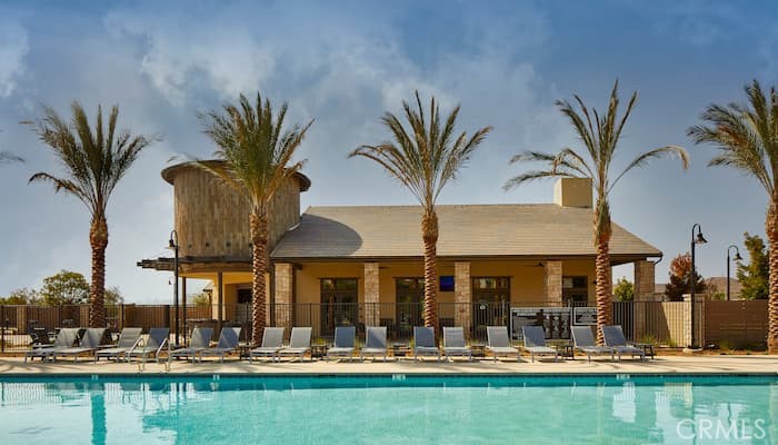 39547 Verbena Way Temecula, CA 92591 - Photo 17 of 21 a view of a swimming pool with a table and chairs