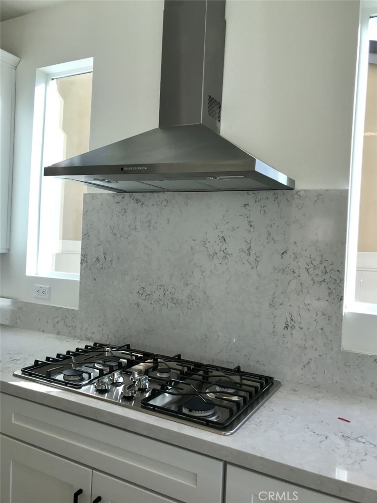 39547 Verbena Way Temecula, CA 92591 - Photo 4 of 21 a close view of stove a stove with kitchen island
