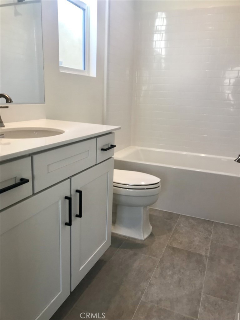 39547 Verbena Way Temecula, CA 92591 - Photo 10 of 21 a bathroom with a sink a toilet and a bathtub