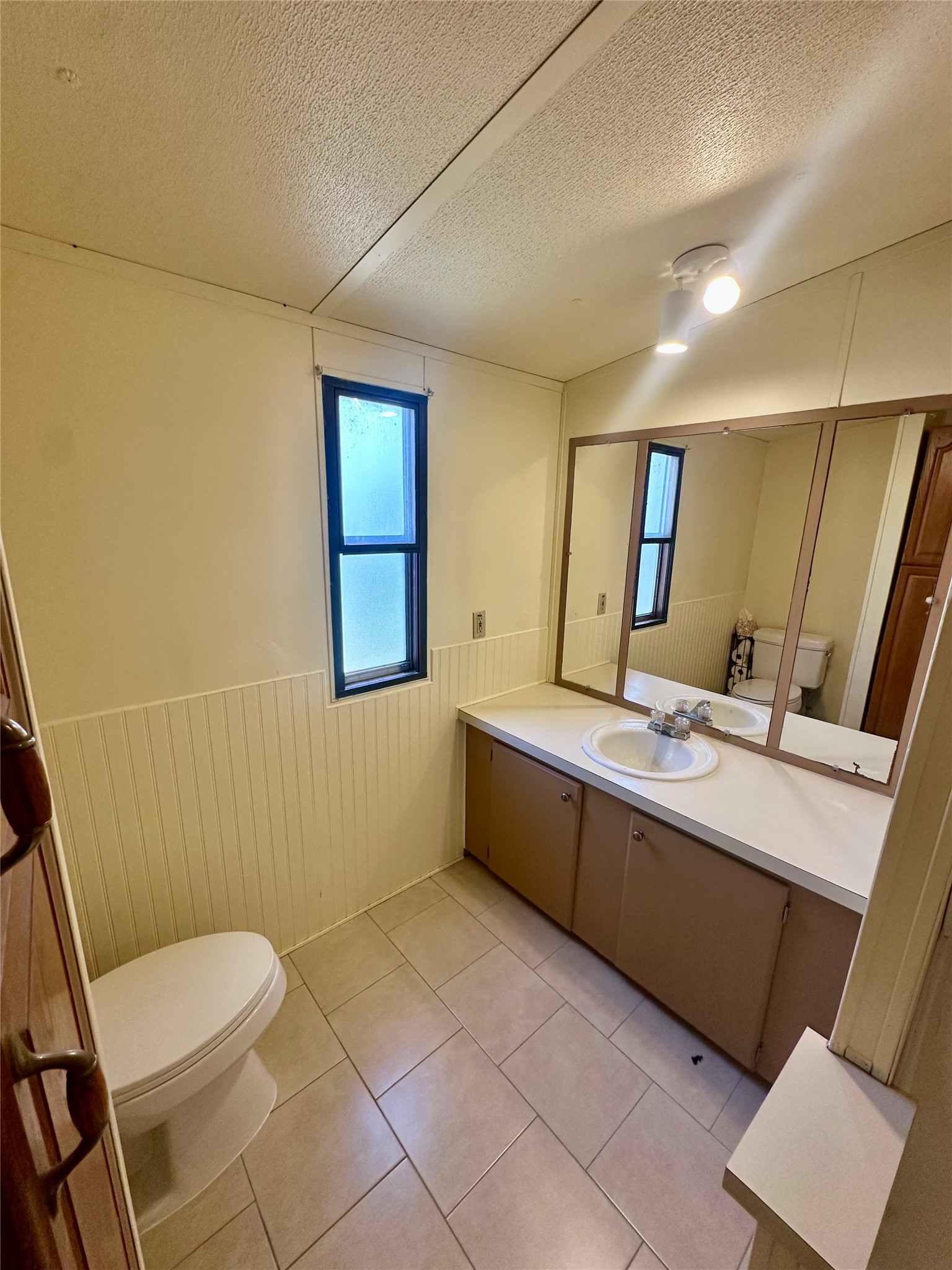 1218 Private Road 3063 Thrall, TX 76578 - Photo 11 of 29 a bathroom with a bathtub sink mirror vanity and toilet