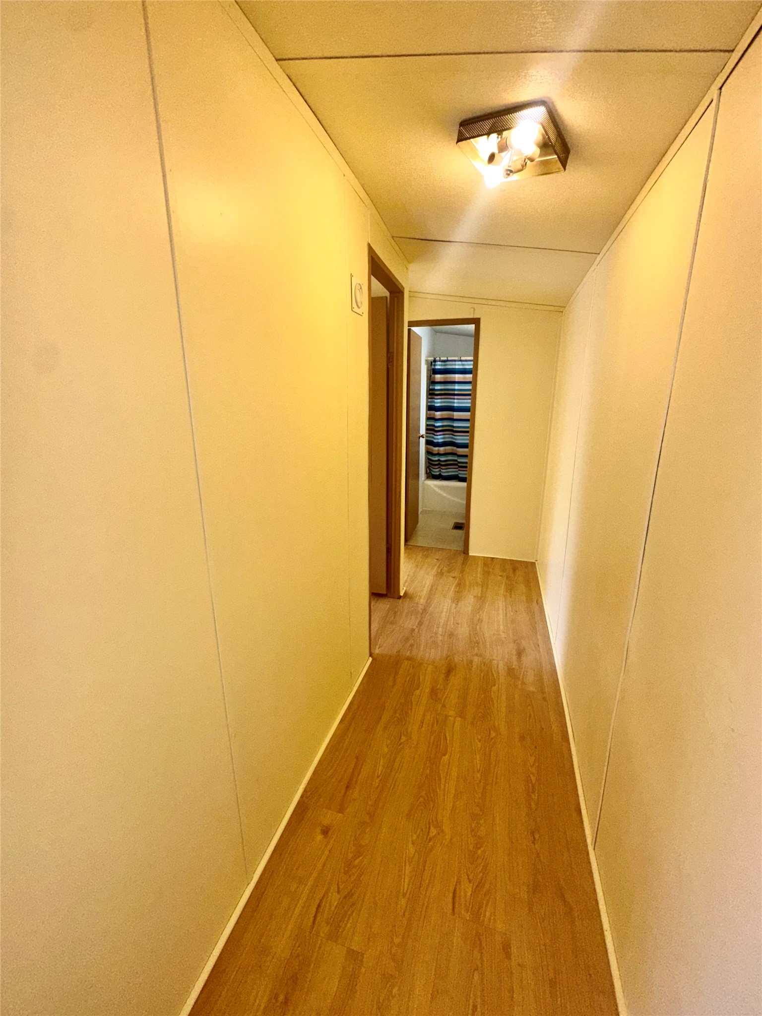 1218 Private Road 3063 Thrall, TX 76578 - Photo 13 of 29 a view of a hallway with wooden floor