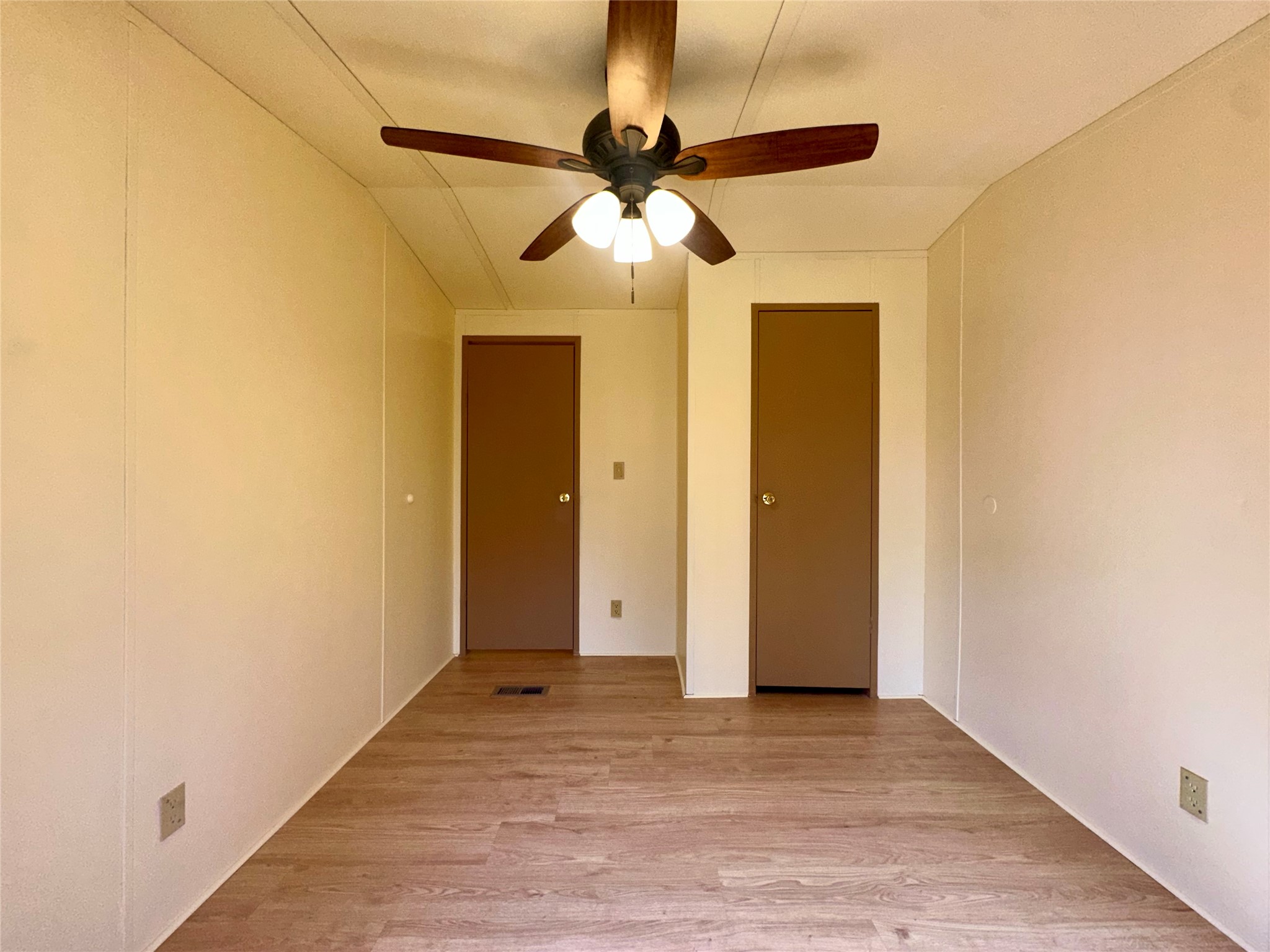 1218 Private Road 3063 Thrall, TX 76578 - Photo 14 of 29 an empty room with a ceiling fan and wooden floor