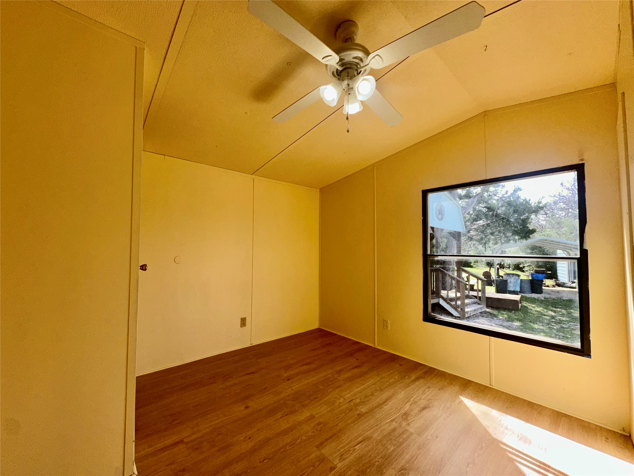 1218 Private Road 3063 Thrall, TX 76578 - Photo 16 of 29 a view of a big room with wooden floor and ceiling fan