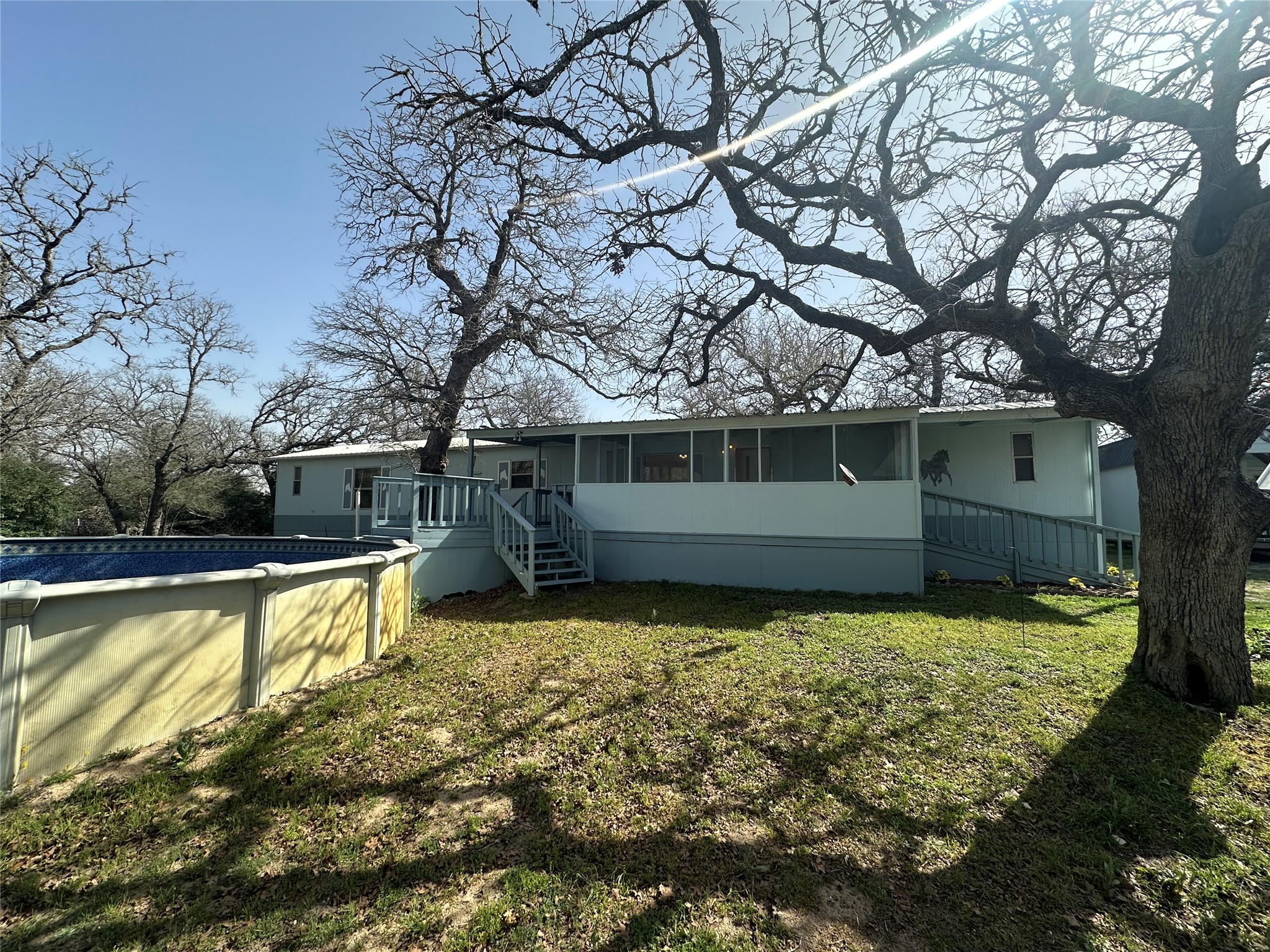 1218 Private Road 3063 Thrall, TX 76578 - Photo 5 of 29 a view of a backyard with a large tree