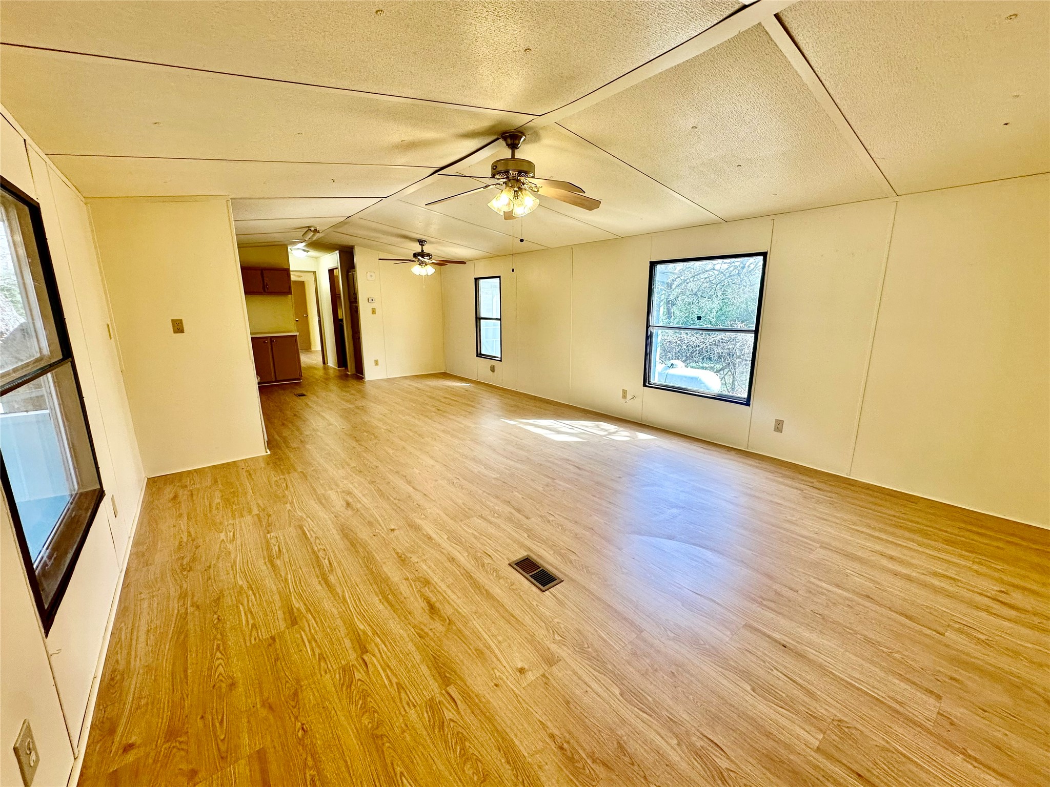 1218 Private Road 3063 Thrall, TX 76578 - Photo 7 of 29 a view of a big room with wooden floor and windows