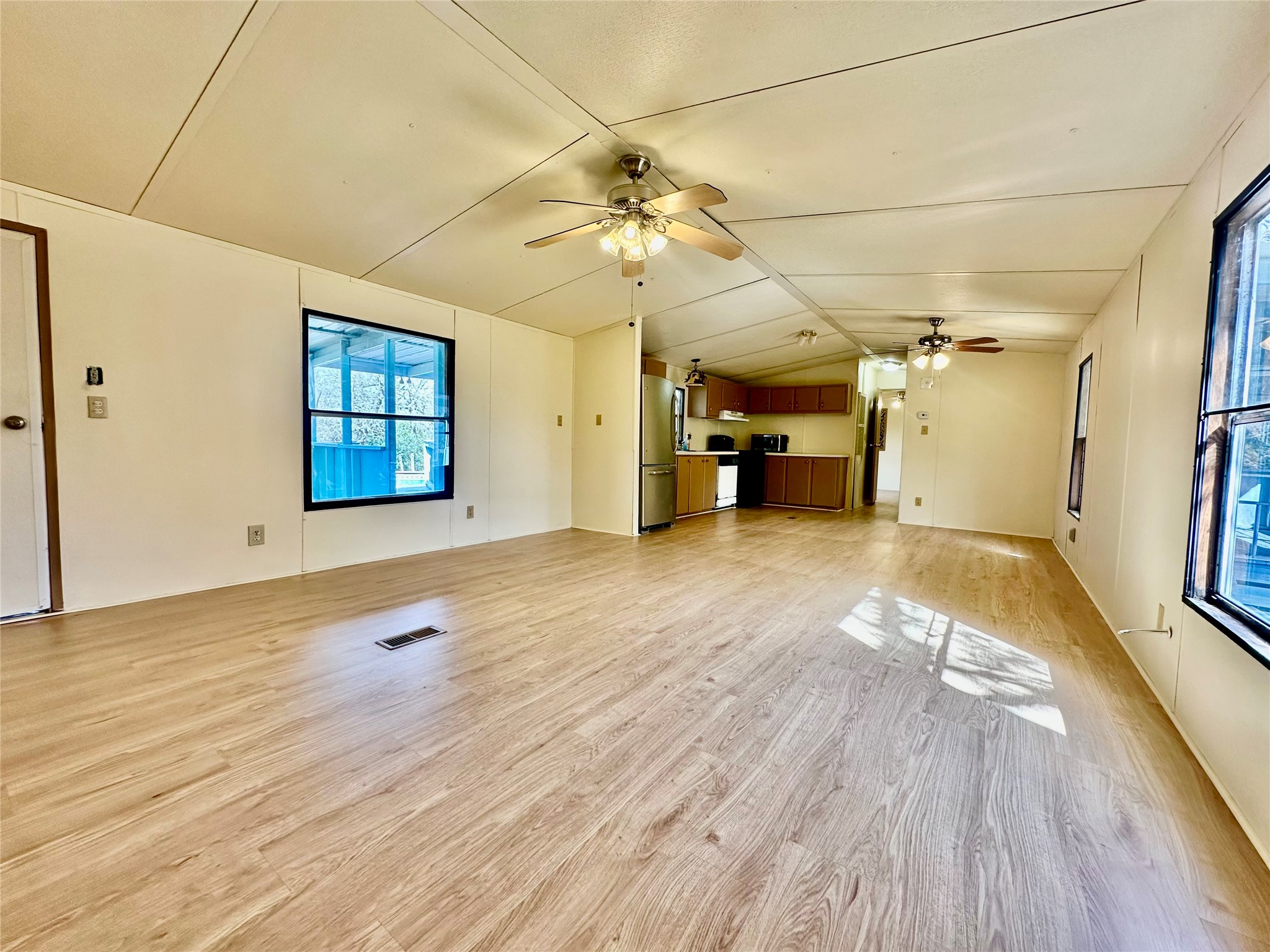 1218 Private Road 3063 Thrall, TX 76578 - Photo 8 of 29 wooden floor in an empty room with a window