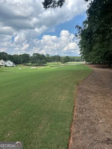 a view of a golf course with a lake