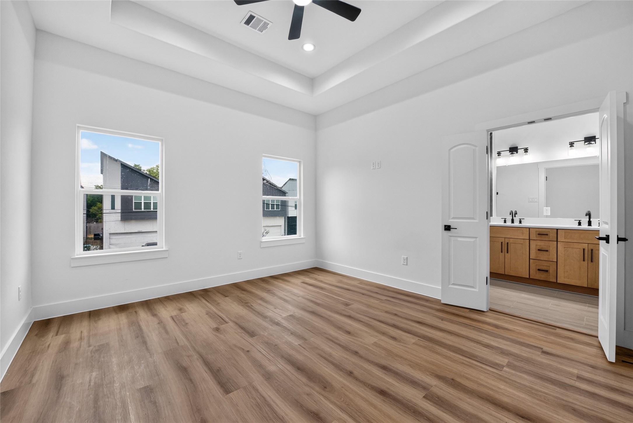 3537 Amos Street Houston, TX 77021 - Photo 24 of 32 Another view of the spacious primary suite, showcasing its bright, inviting atmosphere and comfortable proportions.