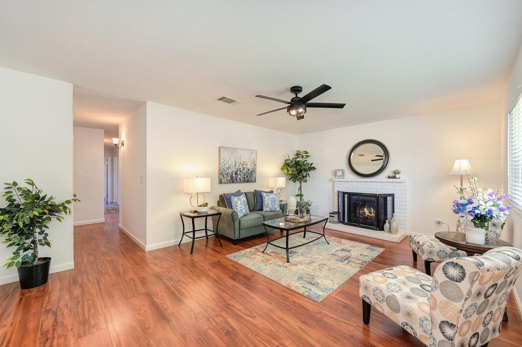 Enter into this clean, freshly painted, spacious living room area with front view of the yard and neighborhood.