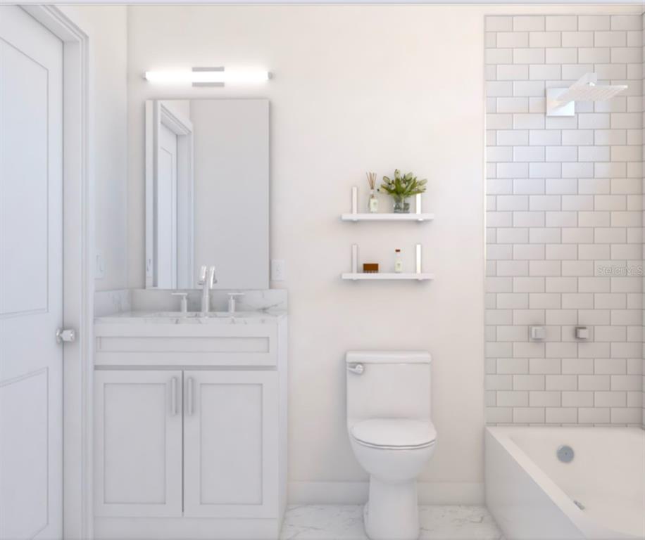 4254 Enid Lane North Port, FL 34288 - Photo 9 of 24 a bathroom with a granite countertop toilet a sink and a bathtub