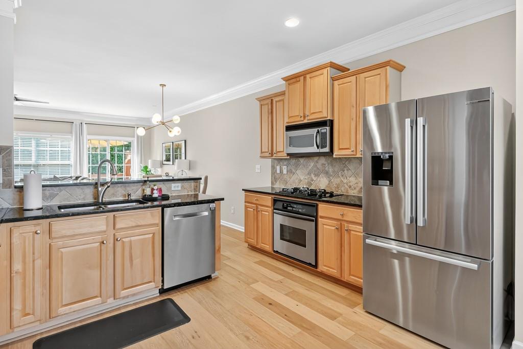 635 Coligny Court Atlanta, GA 30350 - Photo 14 of 31 a kitchen with stainless steel appliances a refrigerator sink and microwave