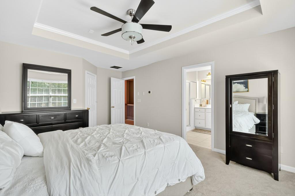 635 Coligny Court Atlanta, GA 30350 - Photo 21 of 31 a bedroom with a bed and a large window