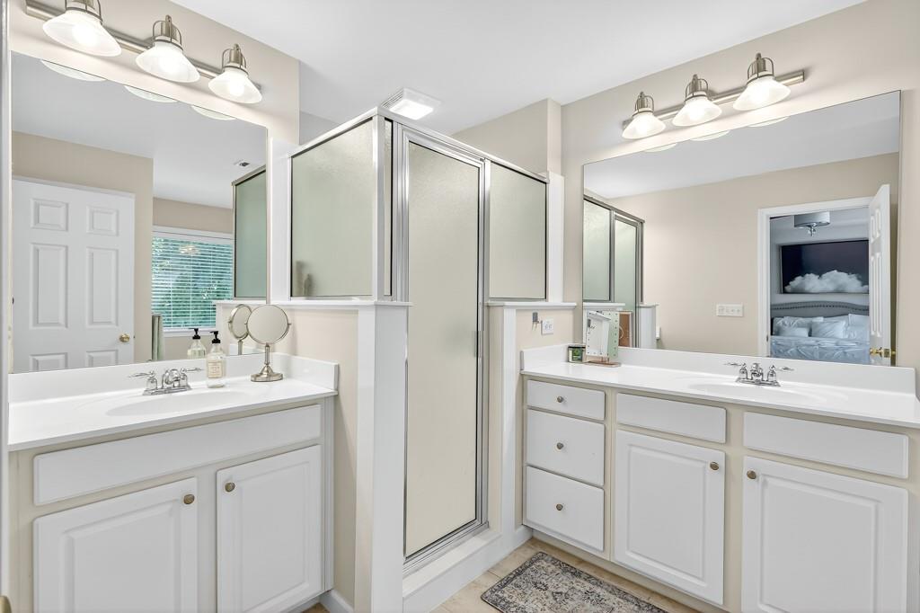 635 Coligny Court Atlanta, GA 30350 - Photo 22 of 31 a bathroom with a double vanity sink mirror and double