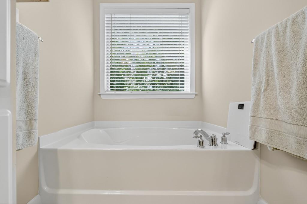 635 Coligny Court Atlanta, GA 30350 - Photo 24 of 31 a white bath tub sitting next to a window