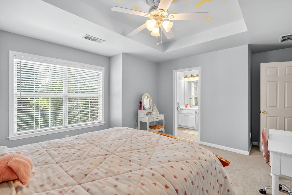 635 Coligny Court Atlanta, GA 30350 - Photo 26 of 31 a bedroom with a large bed and a large window