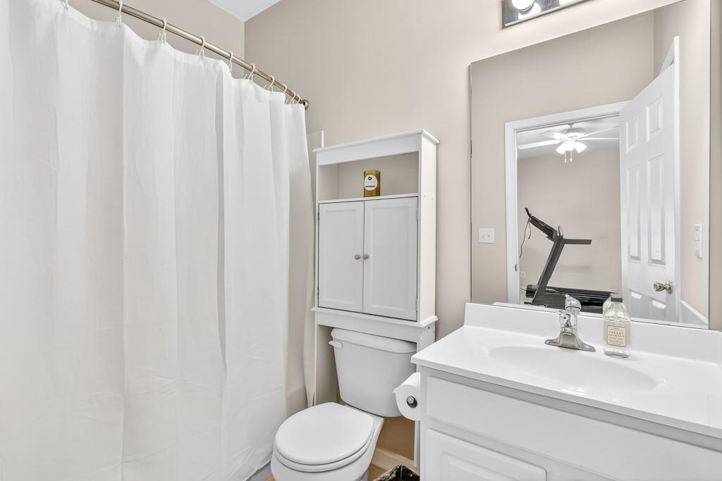 635 Coligny Court Atlanta, GA 30350 - Photo 30 of 31 a bathroom with a sink a toilet and shower