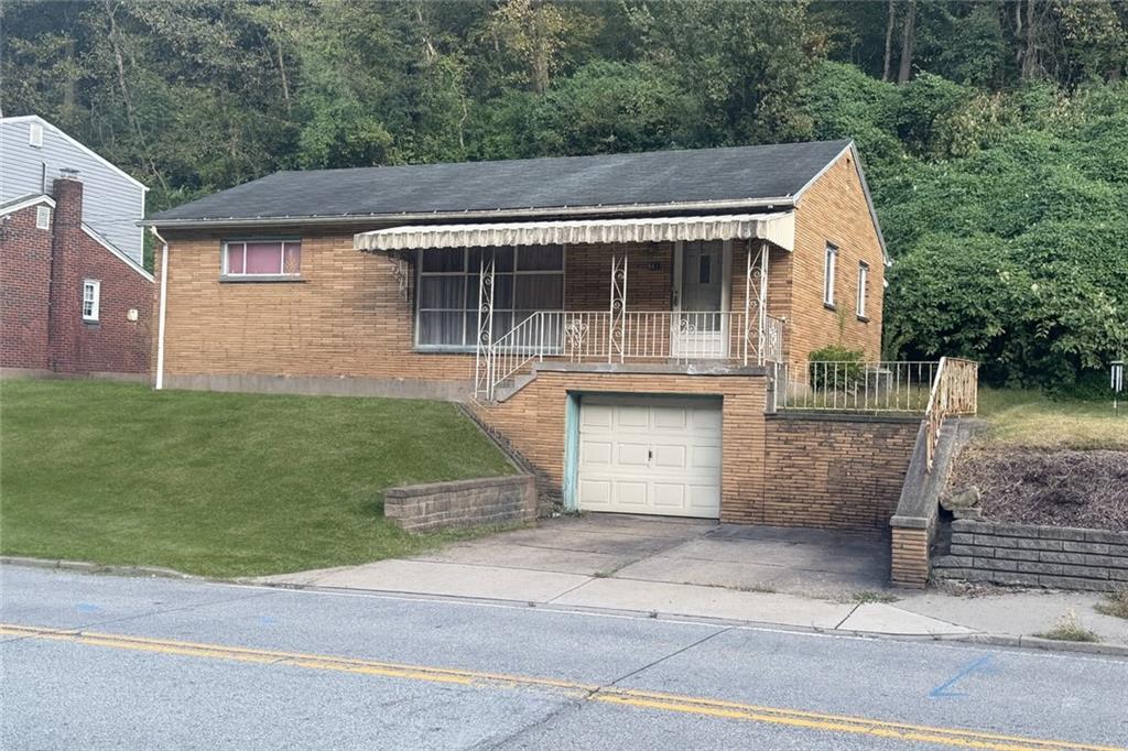 661 Becks Run Road Pittsburgh, PA 15210 - Photo 2 of 4 661 Becks Run Rd has a 1 car garage and 2 off street parking spaces.