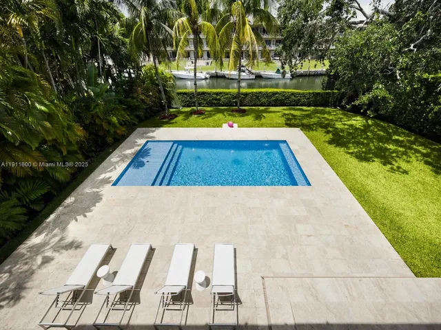 a view of swimming pool with chairs